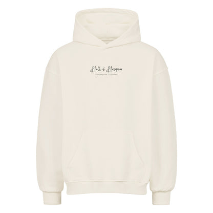 Beiger Oversized Hoodie von Vorne mit Aufdruck Hall of Horsepower Automotive Clothing  in Schwarz in der Mitte auf Brusthöhe. Aufdruck ist etwa 16x5 cm groß.  